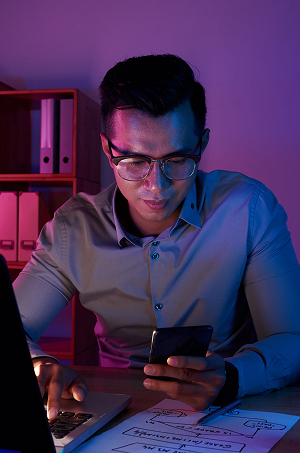 waist-up-shot-man-working-late-computer 1